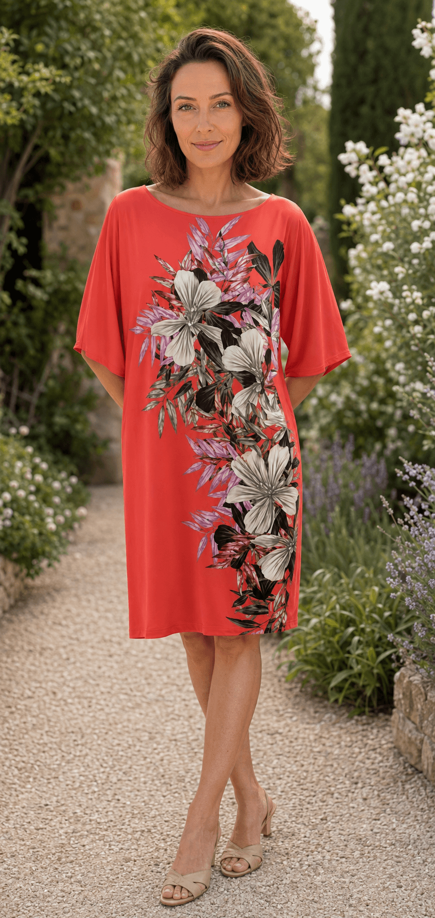 Marciano by Guess Floral Print Shift Dress – Coral displayed on a model in a garden, highlighting women's fashion from premium brands.
