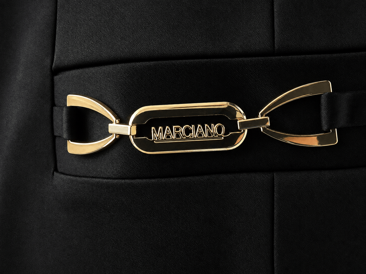 Gold logo detail on the Marciano by Guess Satin Finish Blazer – Black, a luxury women's fashion piece from premium brands.