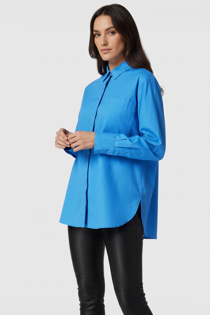 Lifestyle detail - woman adjusting s.Oliver blue shirt sleeve